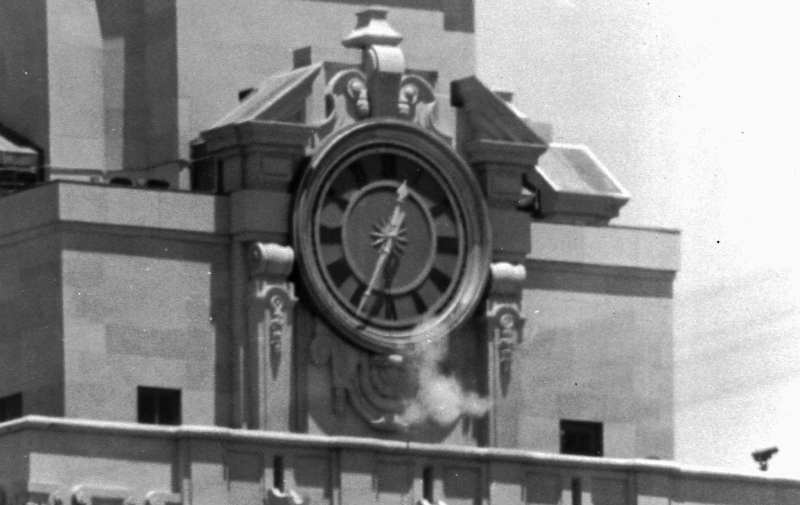 Smoke rises from the sniper’s gun as he fired from the tower of the University of Texas administration building in Austin, Texas, on crowds below on August 1, 1966. Photo via AP.